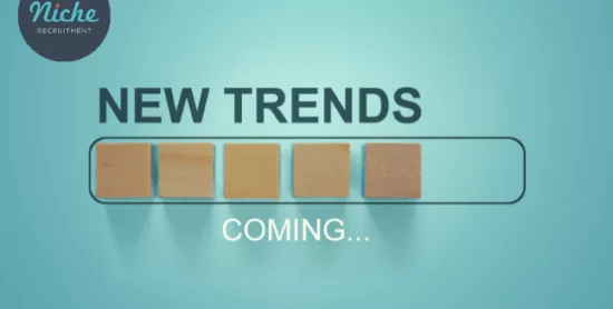 New Trends Coming written on a blue background.