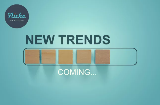 New Trends Coming written on a blue background.